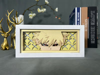 Boite lumineuse Bakugo My Hero Academia éteinte, regard rageur avec yeux rouges et motifs explosifs dorés