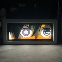 Boite lumineuse Ciel Black Butler rétroéclairée dans l'obscurité, yeux hétérochromiques lumineux posée sur bureau