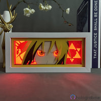Boite lumineuse Edward Elric FMA allumée lumière rouge-orange, regard intense avec symboles alchimie illuminés en rouge