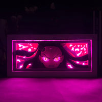 Boite lumineuse Nezuko allumée dans le noir lumière rose intense portrait démon, ambiance chambre manga