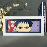 Boite lumineuse Obito Naruto sans rétroéclairage, sharingan rouge et rinnegan violet encadrant le visage