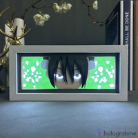 Boite lumineuse Toph Avatar allumée lumière verte, regard déterminé et rochers découpés illuminés en vert vif, décoration