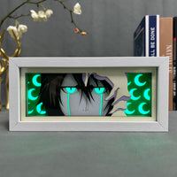 Boite lumineuse Ulquiorra Bleach rétroéclairée turquoise, yeux verts et larmes noires avec lunes croissantes lumineuses