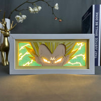 Boite lumineuse Vegeta allumée vert jaune, éclairs de puissance autour du prince des Saiyens en papier découpé multicouche