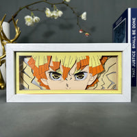 Boite lumineuse Zenitsu Demon Slayer posée sur bureau, cheveux orange avec fond craquelé jaune découpé en papier
